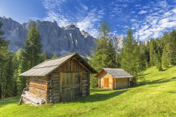 Traditional hut with Puez Group in the background. Longiarù, Badia Valley, South Tyrol, Dolomites, Italy, Europe.