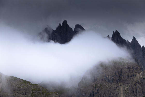 White cloud hides Cadini of Misurina, Province of Belluno, Veneto, Italy,  Europe.