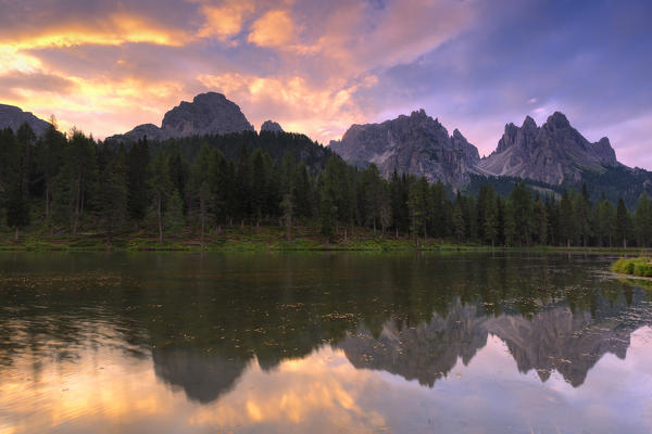 Cadini of Misurina are reflected in the Antorno Lake during sunrise. Dolomites of Sesto / Sexten, Province of Belluno, Veneto, Italy,  Europe.