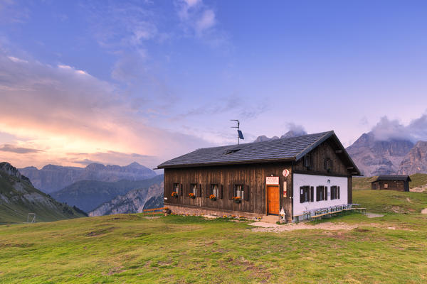 Sunset at Passo San Nicolò Refuge, San Nicolò Pass, Fassa Valley, Trentino, Dolomites, Italy, Europe.