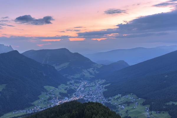 Elevated view of Ortisei at dusk. Gardena Valley, South Tyrol, Dolomites, Italy, Europe.