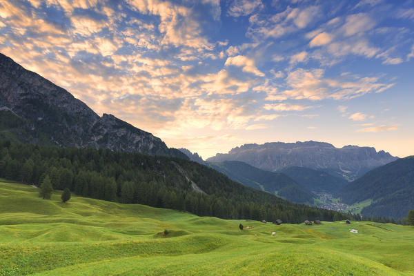 Sunrise in the pasture of Daunei. Selva Val Gardena, Gardena Valley, South Tyrol, Dolomites, Italy, Europe.