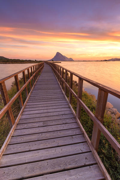 Sunrise from a pedestrian walkway. Porto Taverna, Loiri Porto San Paolo, Olbia Tempio province, Sardinia, Italy, Europe.