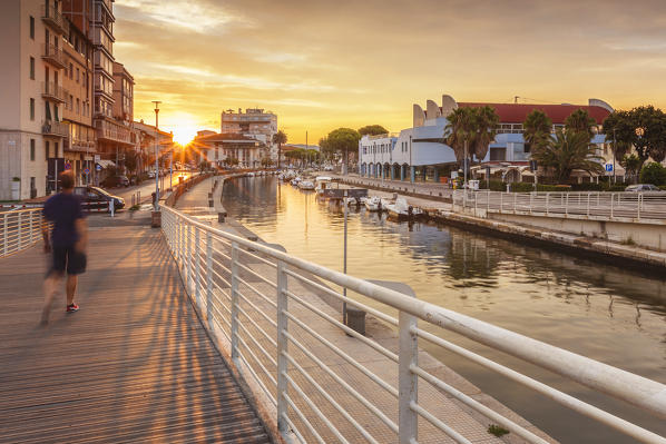 Man walking on the bridge of Canale Burlamacca at the sunrise, Viareggio, Lucca province, Versilia, Tuscany, Italy, Europe (MR)