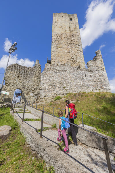 Mom and daughter enter in the Castel Baradello after walking in the Spina Verde, Como, lake Como, Lombardy, Italy, Europe (MR)