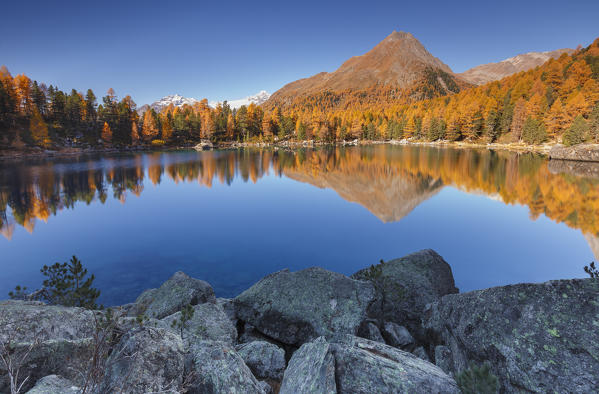 Morning reflections on lake Saoseo, Poschiavo, val di Campo, Canton of Graubunden, Switzerland, Europe