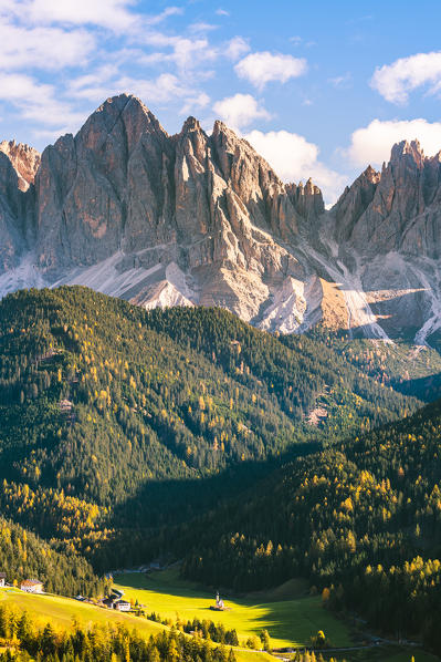 St. Magdalena, Funes Valley, Bolzano, South Tyrol, Trentino Alto Adige, Italy. St. Johann Church with the Odle Dolomites Group in the background.
