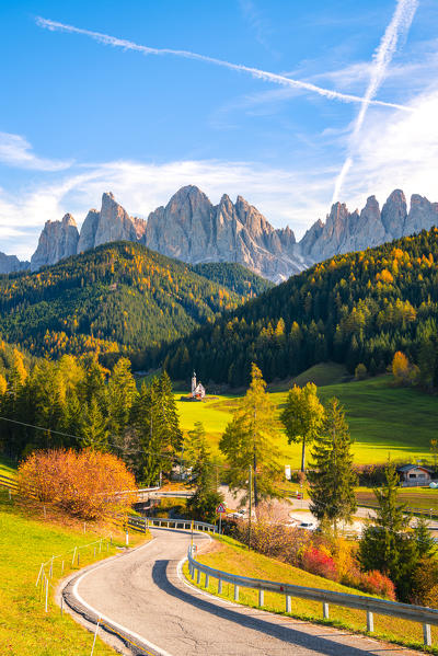 St. Magdalena, Funes Valley, Bolzano, South Tyrol, Trentino Alto Adige, Italy. St. Johann Church with the Puez Odle Dolomites Group in the background.