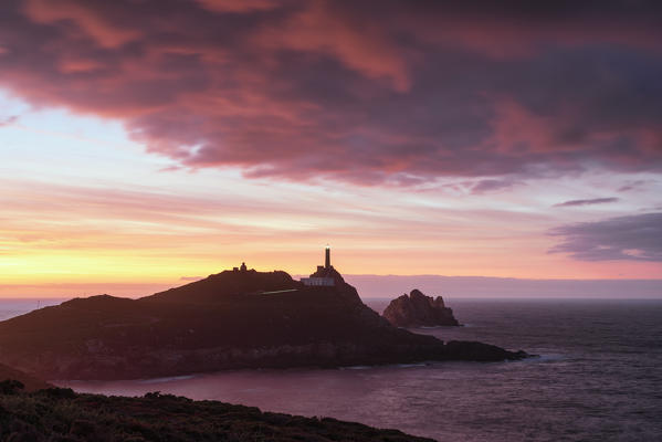 Camarinas, Costa Da Morte (Coast of Death), La Coruna, Galicia, Spain. View of Cape Vilan lighthouse at sunset