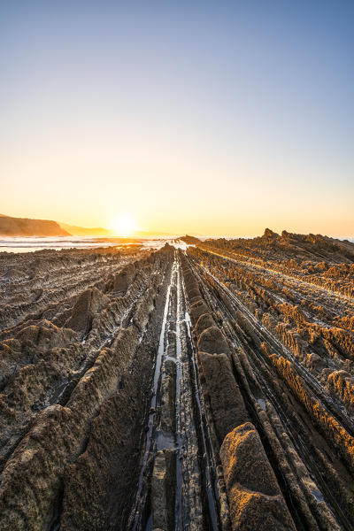 Playa Itzurun, Zumaia, Gipuzkoa, Basque Country, Spain. Flysch formation at sunset