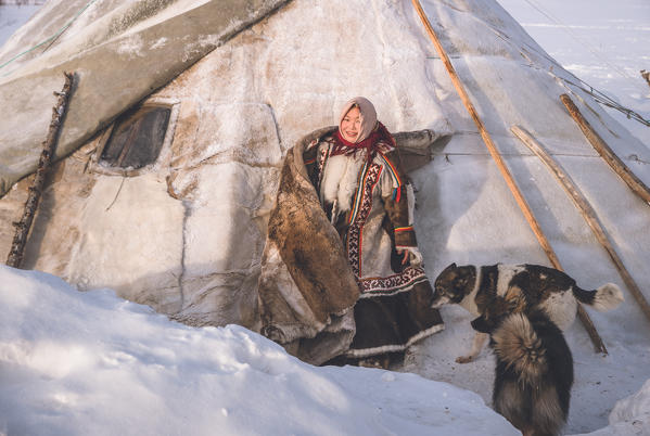 A young nenets girl. The traditional way of daily life at the nomadic reindeer herders camp. Polar Urals, Yamalo-Nenets autonomous okrug, Siberia, Russia