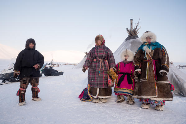 Traditional nenents family at the nomadic reindeer herders camp. Polar Urals, Yamalo-Nenets autonomous okrug, Siberia, Russia