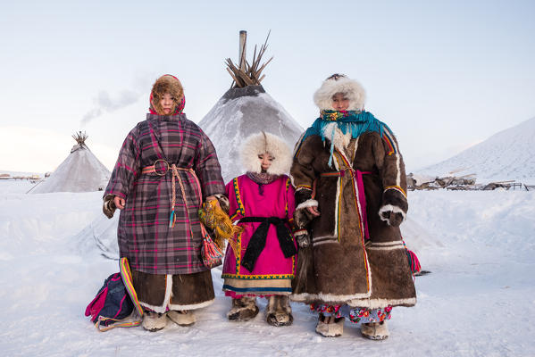 Traditional nenents family at the nomadic reindeer herders camp. Polar Urals, Yamalo-Nenets autonomous okrug, Siberia, Russia