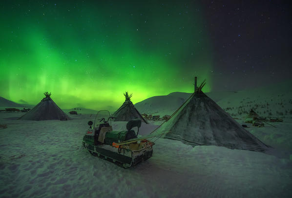 Northern lights at the nomadic reindeer herders camp. Polar Urals, Yamalo-Nenets autonomous okrug, Siberia, Russia