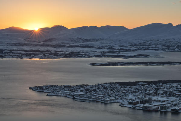 Panoramic view of the city of Tromsø at sunset from the mountain top reached by the Fjellheisen cable car,Troms county, Northern Norway, Europe