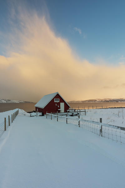 the typical rorbuer house over the coastline, Tromso, Troms county, Northern Norway, Europe