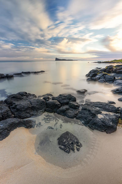 the quiet of a colorful sunrise at the beach, Pamplemousses district, Mauritius, Africa