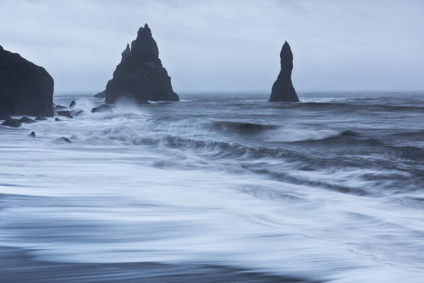 the epic stacks of Vik i Myrdal photographed on a gloomy day typical of the Icelandic winter, Vik i Myrdal, Vestur-Skaftafellssýsla county, Sudurland, Iceland, Europe