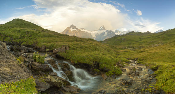 a small waterfall shot near the Bachalpsee, with the peak of the Schreckhorn in the background, Grindelwald, Canton of Bern, Switzerland, Europe