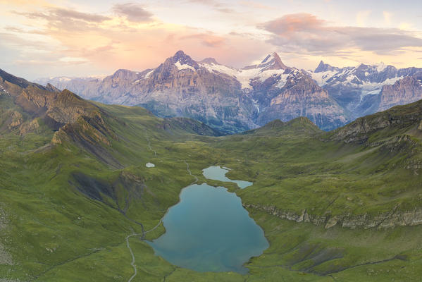 aerial view of Bachalpsee during a warm coloured sunset in summer time, Grindelwald, Canton of Bern, Switzerland, Europe