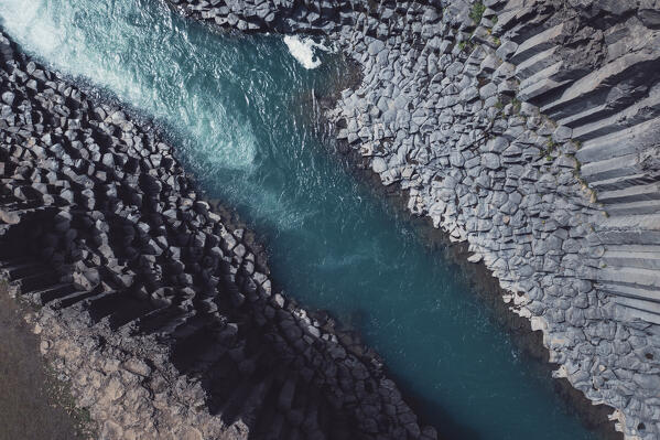 aerial view taken by drone of Studagil canyon, during a summer day, Austurland, Eastern Iceland, Iceland, Europe.