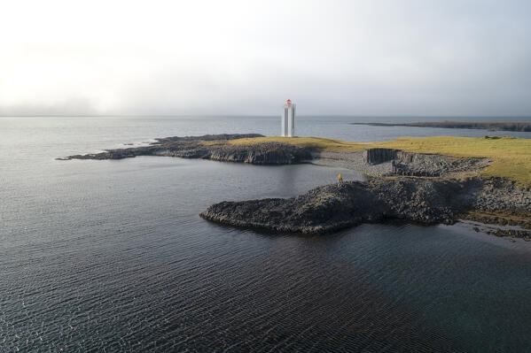 aerial view taken by drone of Kálfshamarsvik lighthouse, Nordurland, Iceland, Europe