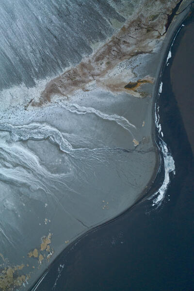 aerial abstract taken by drone of icelandic river during a winter day, Austurland, Iceland, Europe