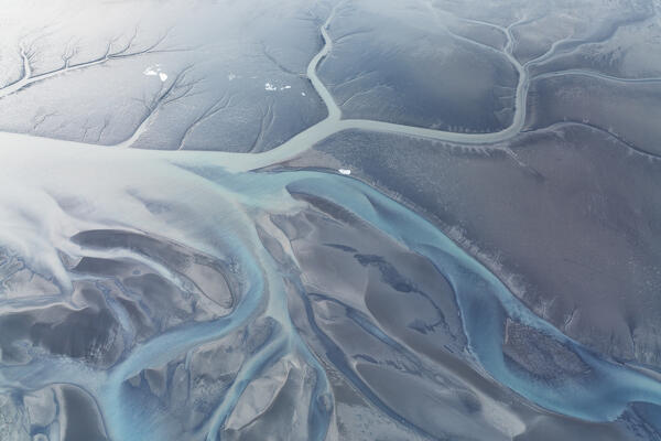aerial abstract taken by drone of icelandic river during a winter day, Austurland, Iceland, Europe