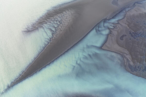 aerial abstract taken by drone of icelandic river during a winter day, Austurland, Iceland, Europe
