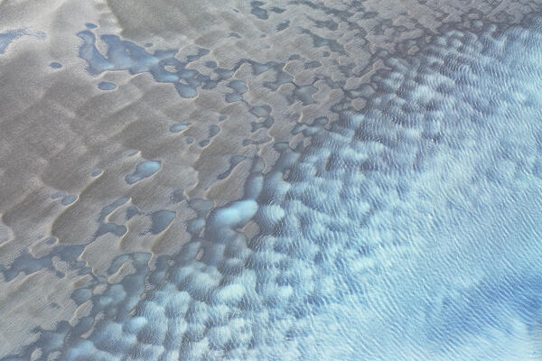 aerial abstract taken by drone of icelandic river during a winter day, Austurland, Iceland, Europe