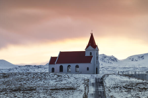 a long exposure to take a warm sunrise at Ingjaldshóll churc, Snaefells Peninsula, Vesturland, Iceland, Europe