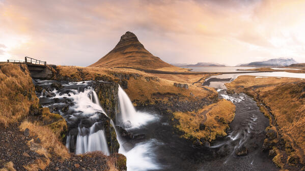 a panoramic view of the Kirkjufell mount and waterfall during a winter sunrise, Snaefells Peninsula, Vesturland, Iceland, Europe