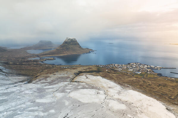 aerial view of Grundafjordur taken by drone during a winter snowfall, Snaefells Peninsula, Vesturland, Iceland, Europe