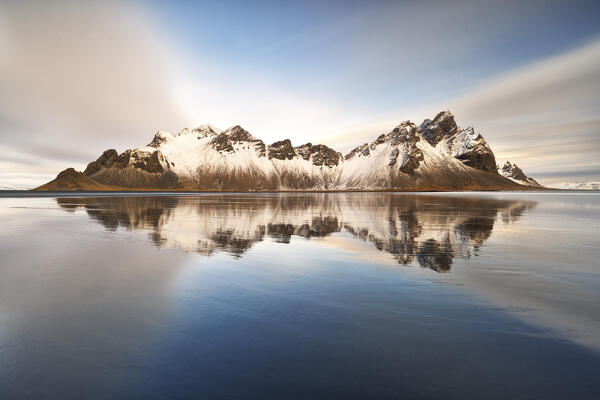 Vestrahorn mountain reflected on the shore at sunset, Stokksnes, Hofn, southern Iceland, Europe 