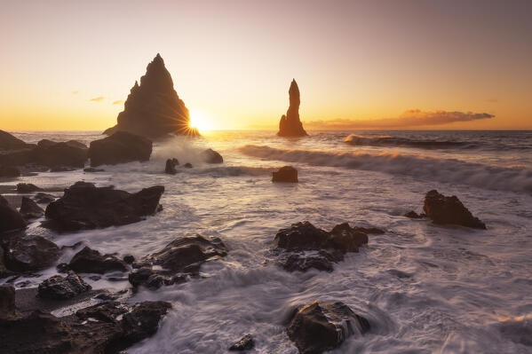 the stacks of Vik i Myrdal, seen from Reynisfjara beach, during a winter sunrise, southern Iceland, Europe