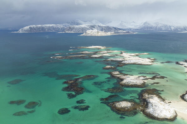 aerial view taken by drone of archipelago near to Sommaroy island during a cloudy winter day, Troms county, northern Norway, Europe