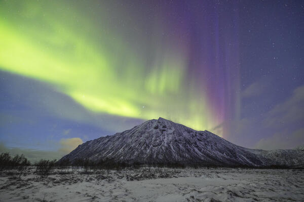 the Northen Lights over the peaks near to Gryllefjord, Senja, Norway, Europe