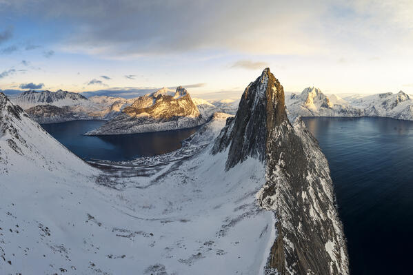 Aerial view taken from the drone of iconic Segla mountain during a winter sunset, Senja, Norway, Europe