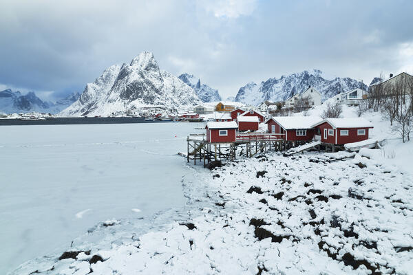 Winter day in Reine village with mountain peak covered with snow, Lofoten Islands, Norway, Europe