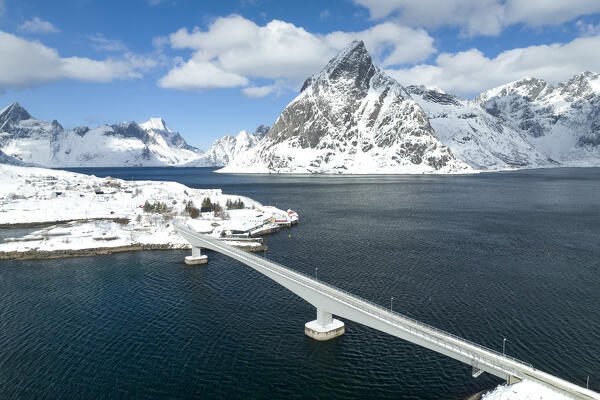 Winter day in Reine village with Olstind peak covered with snow, Lofoten Islands, Norway, Europe