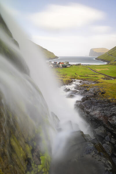 Small waterfall and Tjørnuvik village, Sunda municipality, Streymoy, Faroe Islands, Denmark, Scandinavia