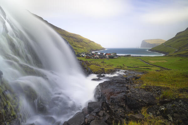 Small waterfall and Tjørnuvik village, Sunda municipality, Streymoy, Faroe Islands, Denmark, Scandinavia