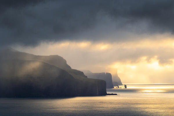 a magical light envelope the Risin og Kellingin during an autumn sunset, Sunda municipality, Eysturoy, Faroe Islands, Denmark, Scandinavia