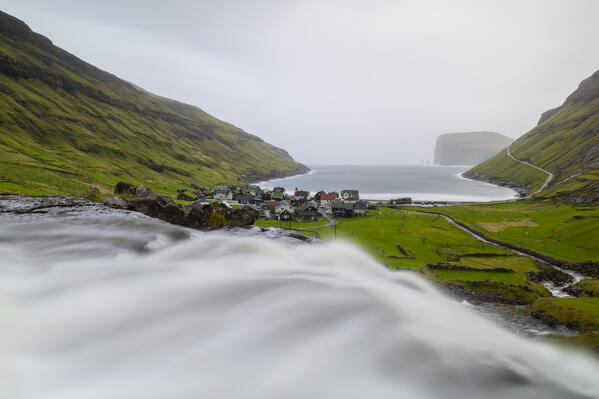 Small waterfall and Tjørnuvik village, Sunda municipality, Streymoy, Faroe Islands, Denmark, Scandinavia
