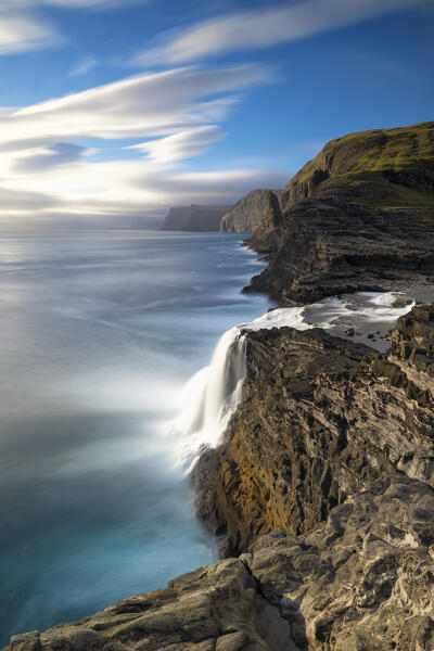 Bøsdalafossur waterfall from Sørvagsvatn during an autumn sunny day, Vagar, Faroe Islands, Denmark, Scandinavia