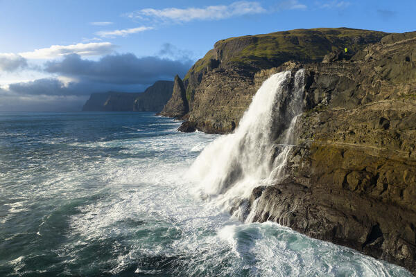 Bøsdalafossur waterfall from Sørvagsvatn during an autumn sunny day, Vagar, Faroe Islands, Denmark, Scandinavia