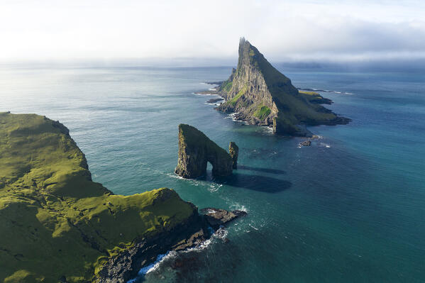 aerial view taken by drone of  Tindholmur and Draganir islands during an autumn day, Sorvagur, Faroe Island, Europe