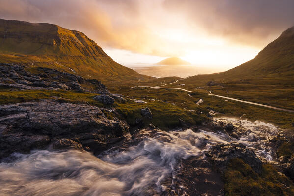 View of Koltur island with a bendings road in the foreground, Streymoy, Torshavnar municipality, Faroe Islands, Denmark, Scandinavia, Europe
