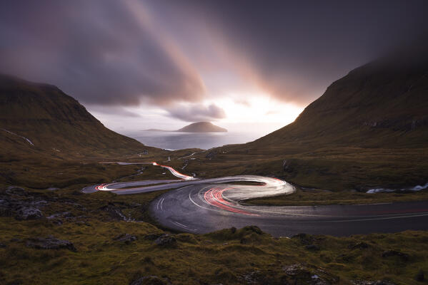 View of Koltur island with a bendings road in the foreground, Streymoy, Torshavnar municipality, Faroe Islands, Denmark, Scandinavia, Europe