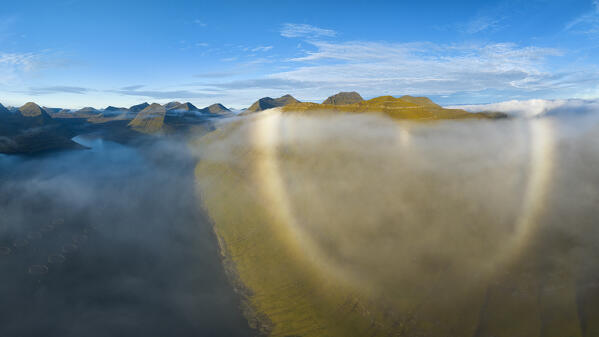 aerial view taken by drone of the peaks and fjord near to Gjogv during an autumn day, Funnigfjordur, Eysturoy, Faroe Island, Denmark, Europe